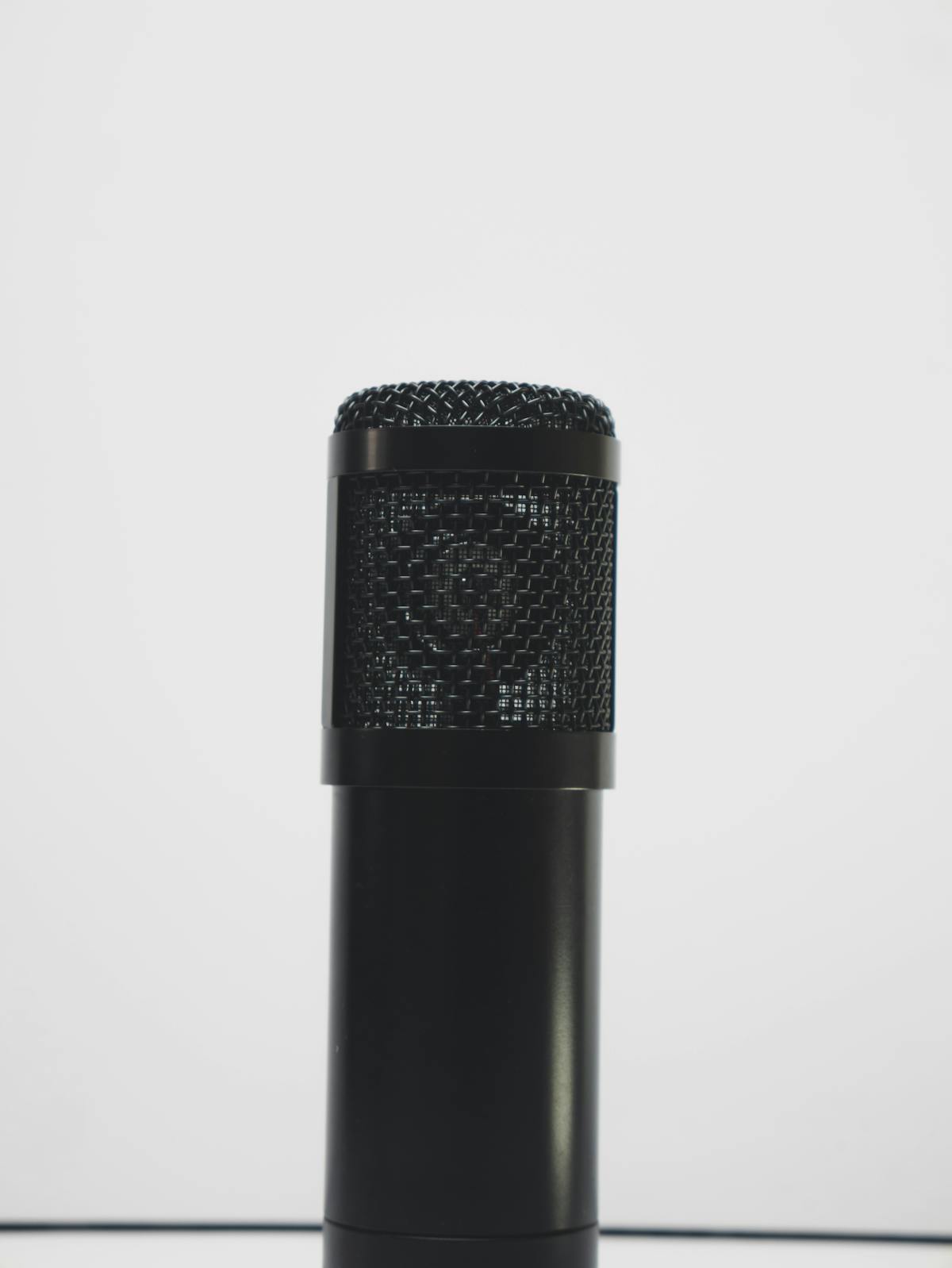 Studio condenser microphone on a clean white background